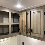 Overhead cabinets over sink shown open May Show Optional Features. Features and Options Subject to Change Without Notice.